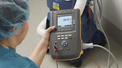 Biomed technician using an ESA615