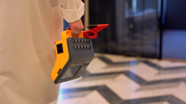 ESA710 Electrical Safety Analyzer held by the handle