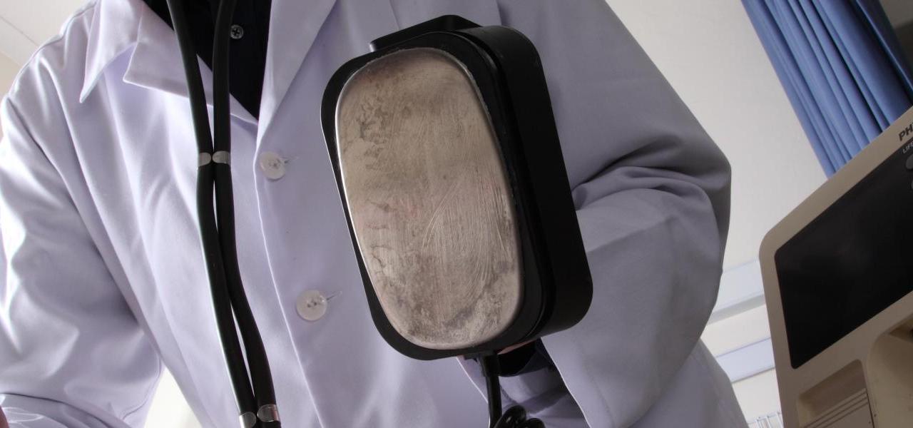 A doctor using a defibrillator A doctor using a defibrillator