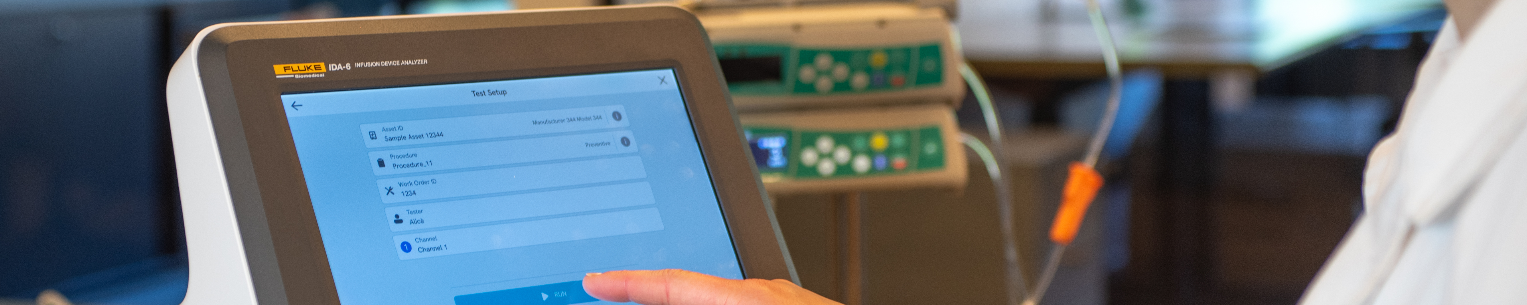 Technician using touchscreen on IDA-6